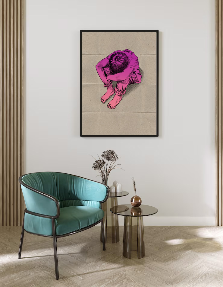 A room interior showing a print on the wall of aboy sitting on the ground with his head in his knees